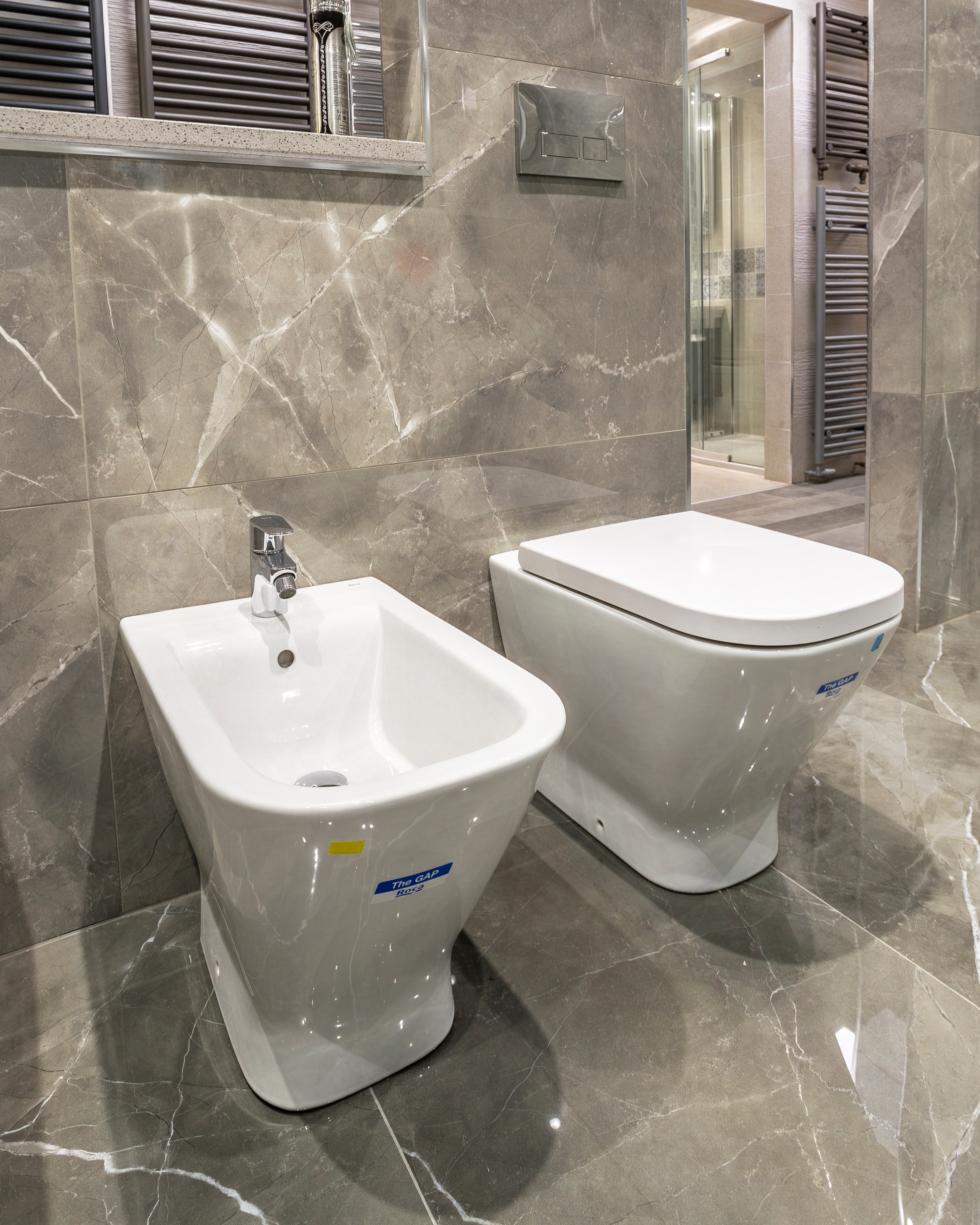 Grey marble bidet and toilet