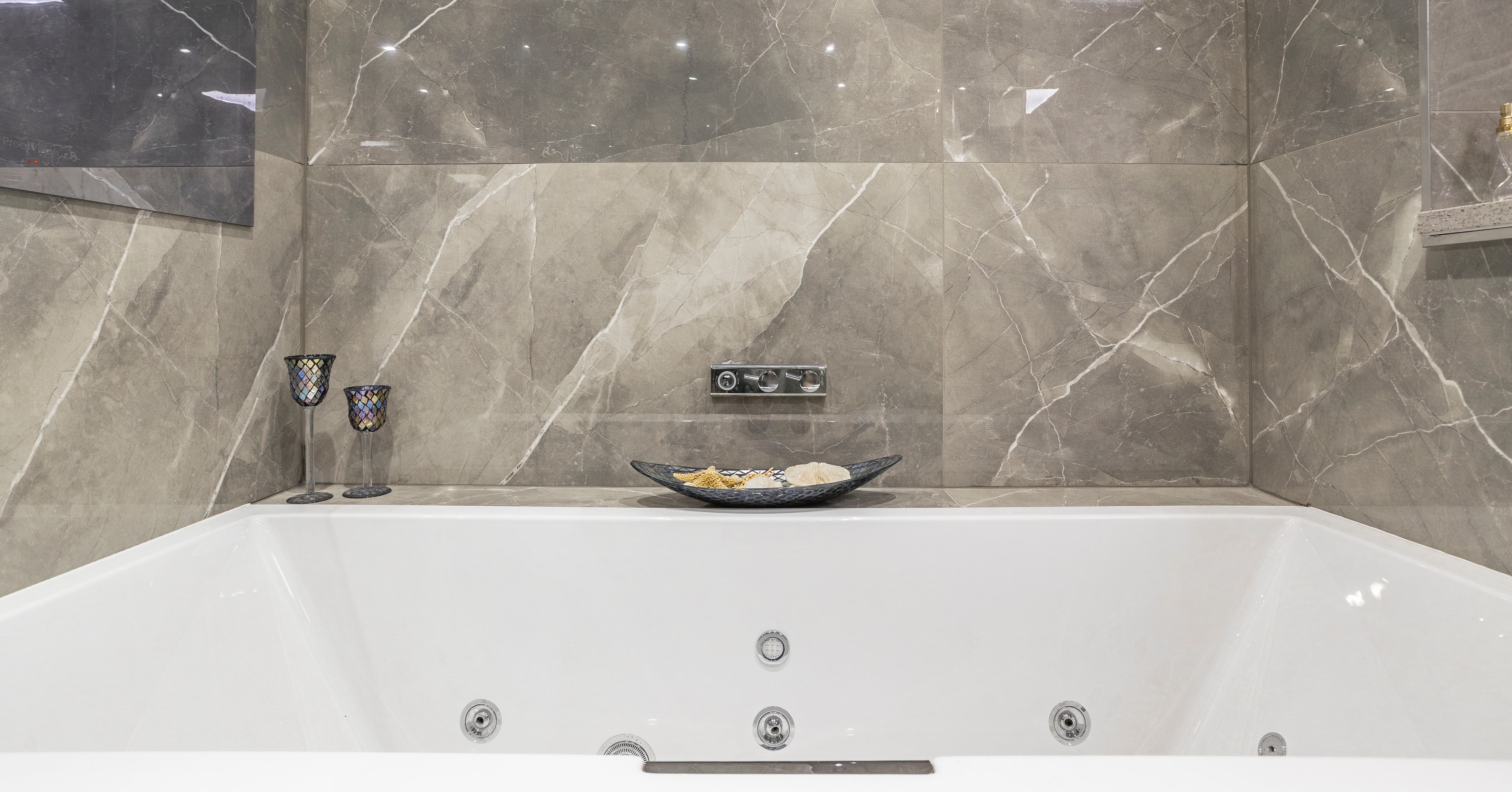 Grey marble whirlpool bath