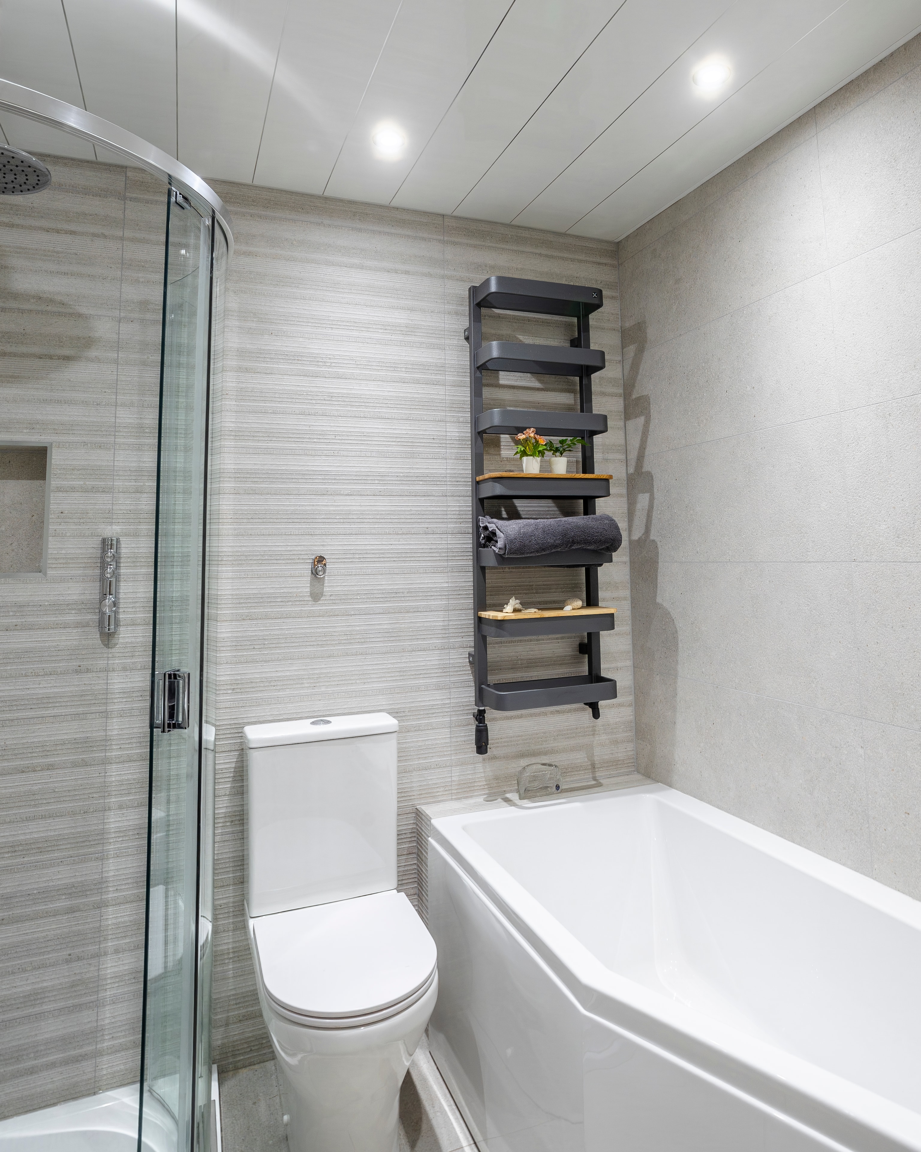 Full grey tiled bathroom